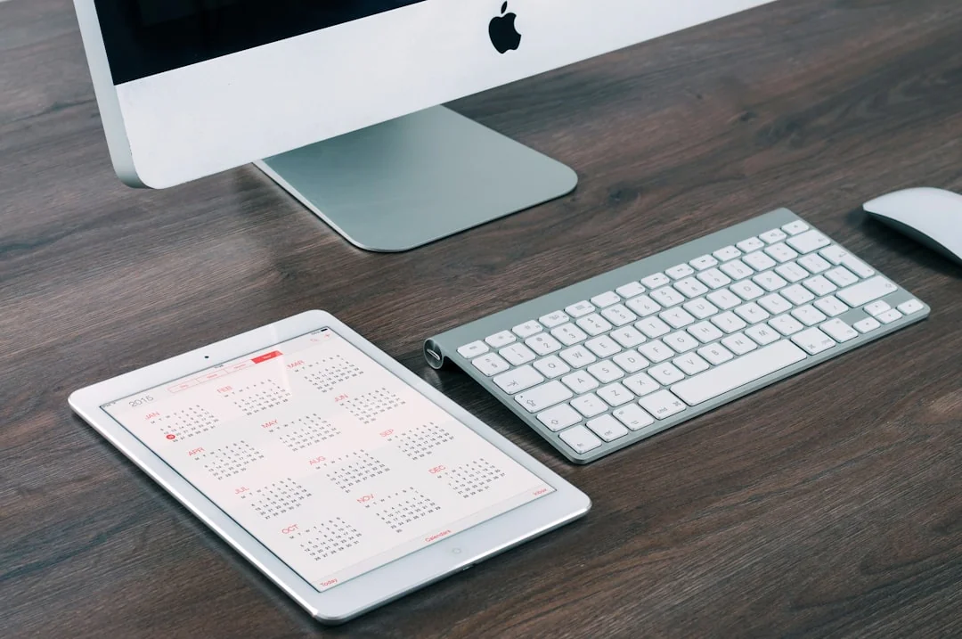 A contemporary workspace showcasing a laptop, tablet, and smartphones, ideal for tech and freelance use.